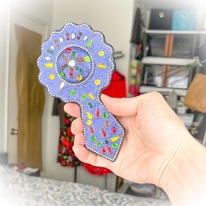 Colorful Handheld Mirror with Blue Accents
